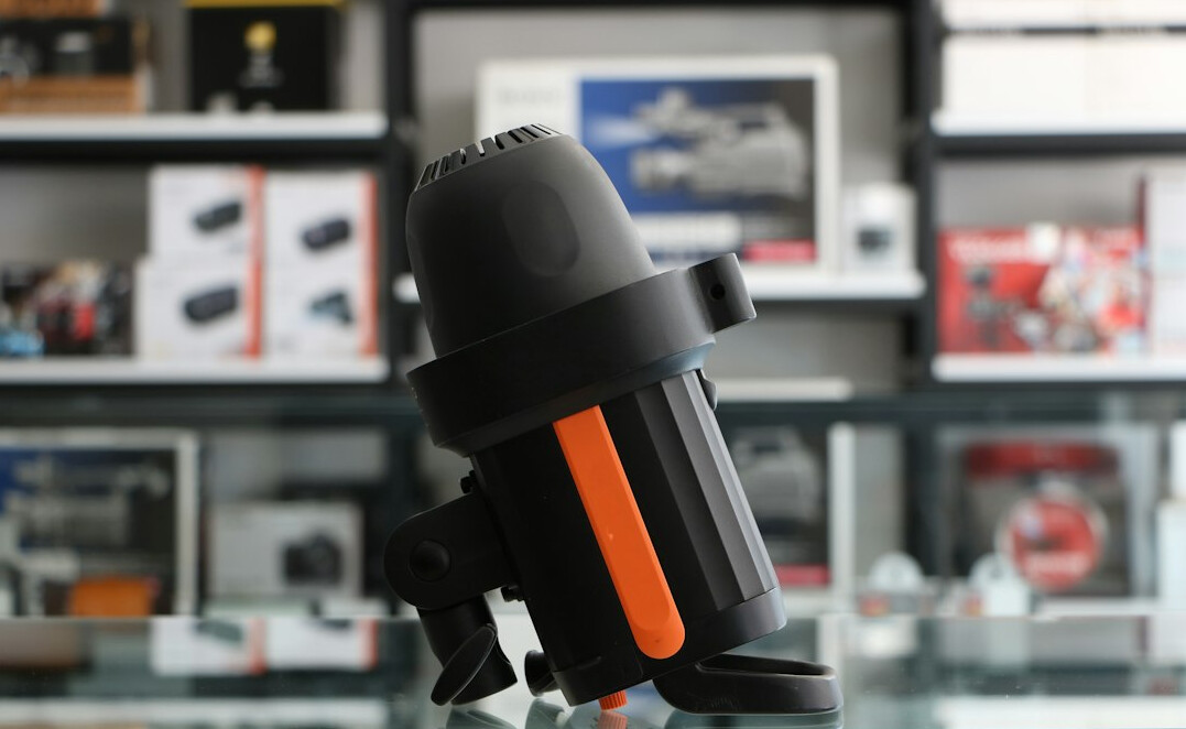 Video camera on a tripod in a warm interview studio