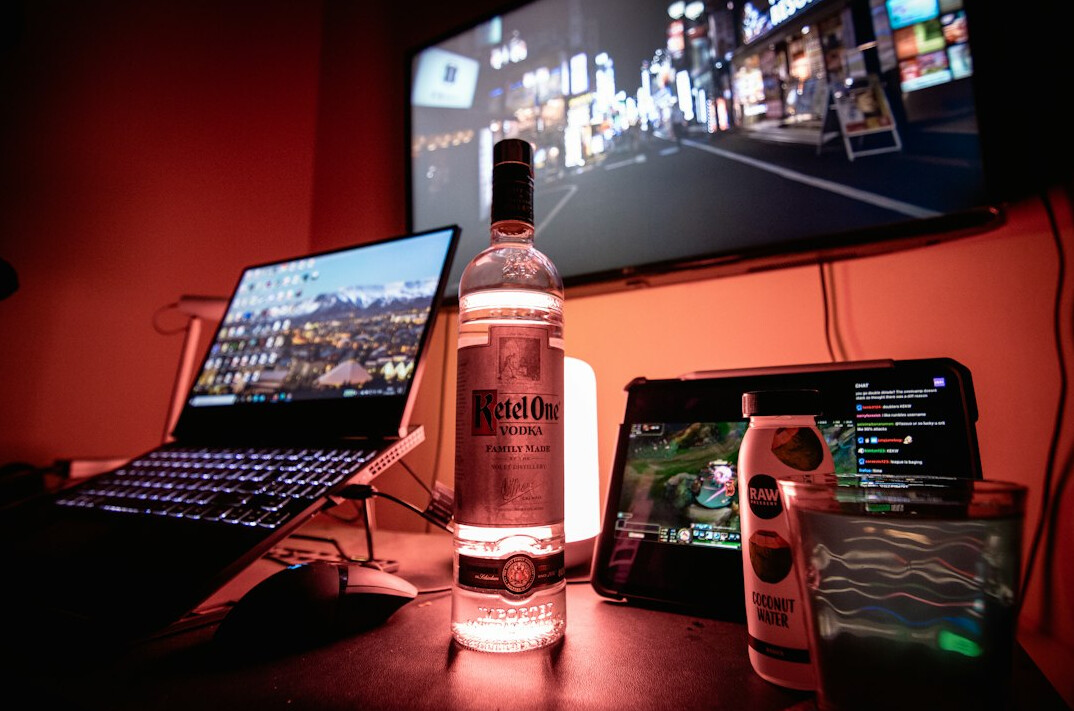 Laptop on a desk with a video editing timeline