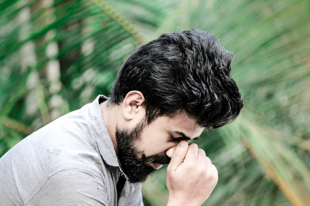 Portrait of a bearded man with a calm expression