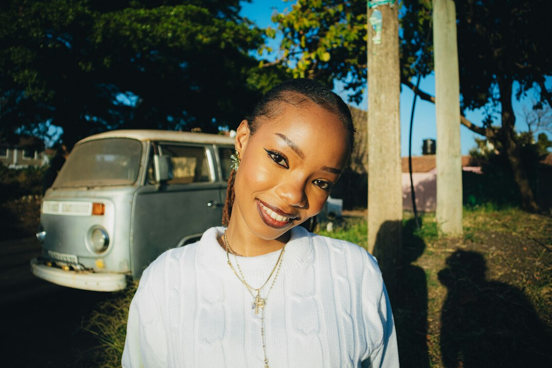 Portrait of a young woman smiling outdoors