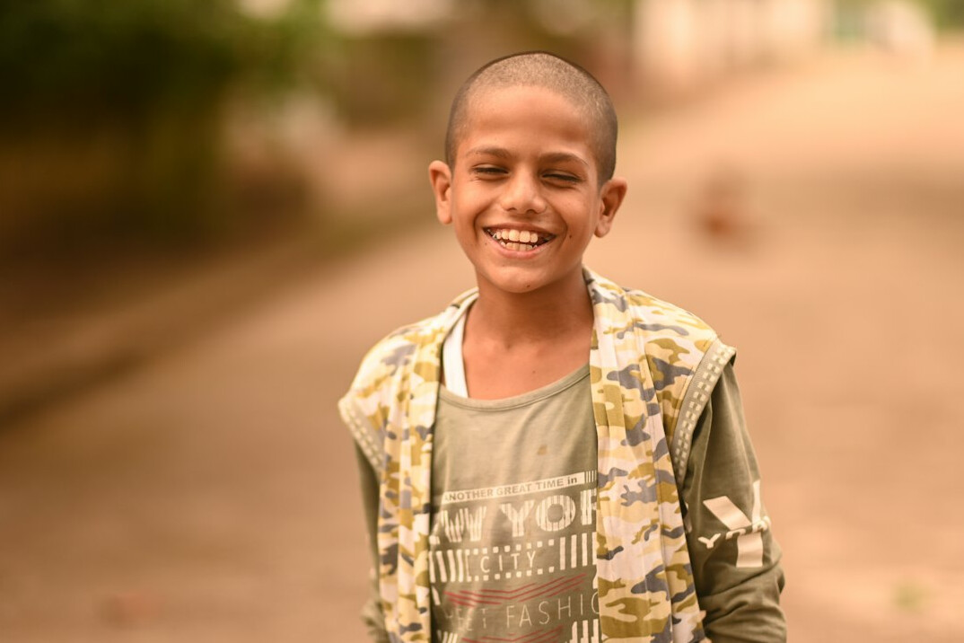 Portrait of a man with short hair smiling